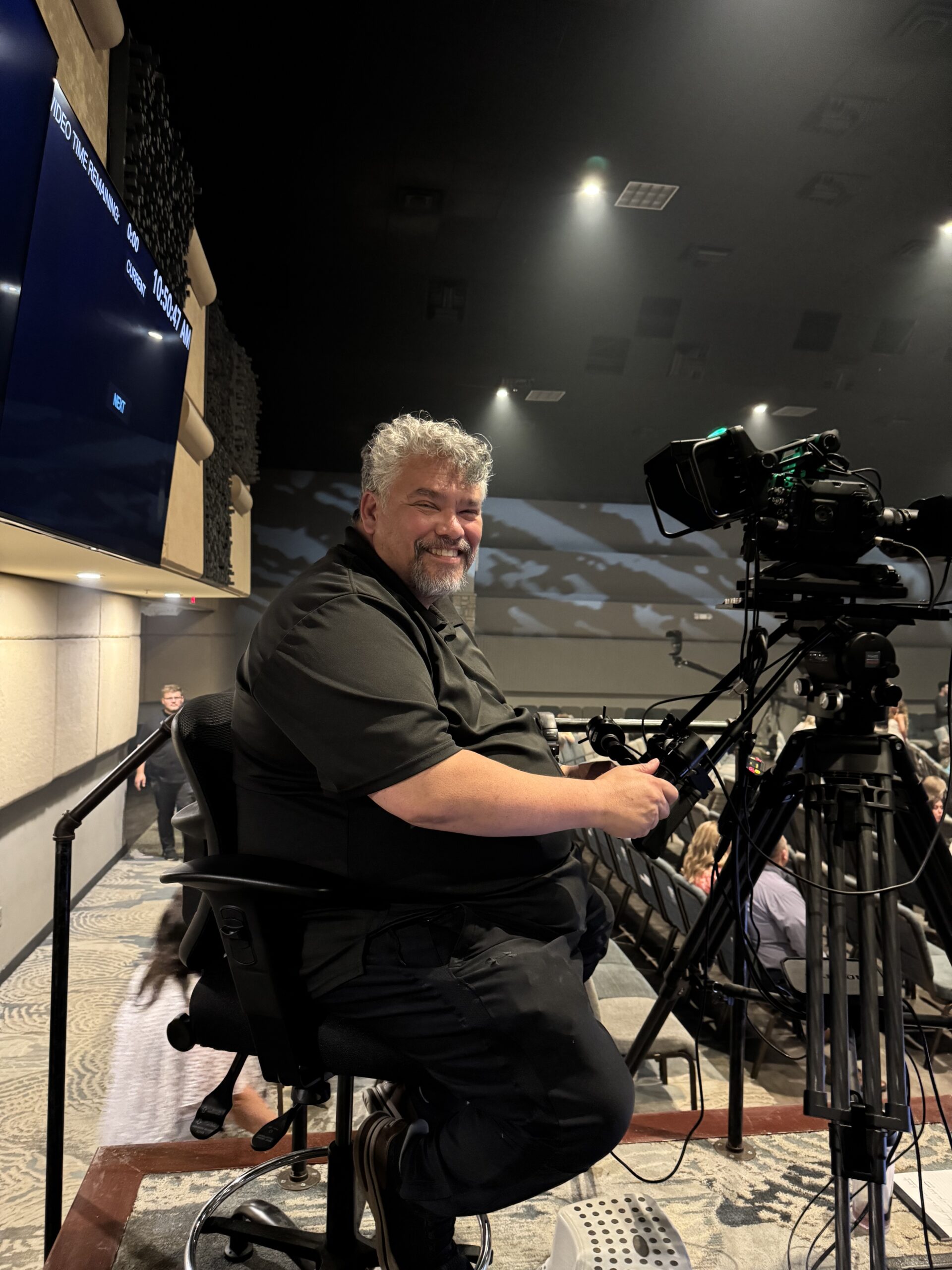 Anthony Wallace operating a stationary camera